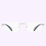 The Maybach Optical Frame THE ARTIST IX P-AAS-Z25 by Maybach Sunglasses features rimless clear RX lenses, silver metal arms, and is shown front-facing on a light purple background.