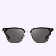 Maybach THE DEAN I PA-AB-Z36 52-19-145 Unisex Sunglasses by Maybach Sunglasses, with black upper frames, dark lenses, and silver metal rims and accents, shown against a light purple background.