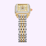 The Michele Watches Deco Madison Mini MWW06D000178 is a luxurious diamond watch featuring a square, gold and diamond-adorned face with refined gold accents and a dual-tone silver and gold metal link band, displayed against a light purple background.