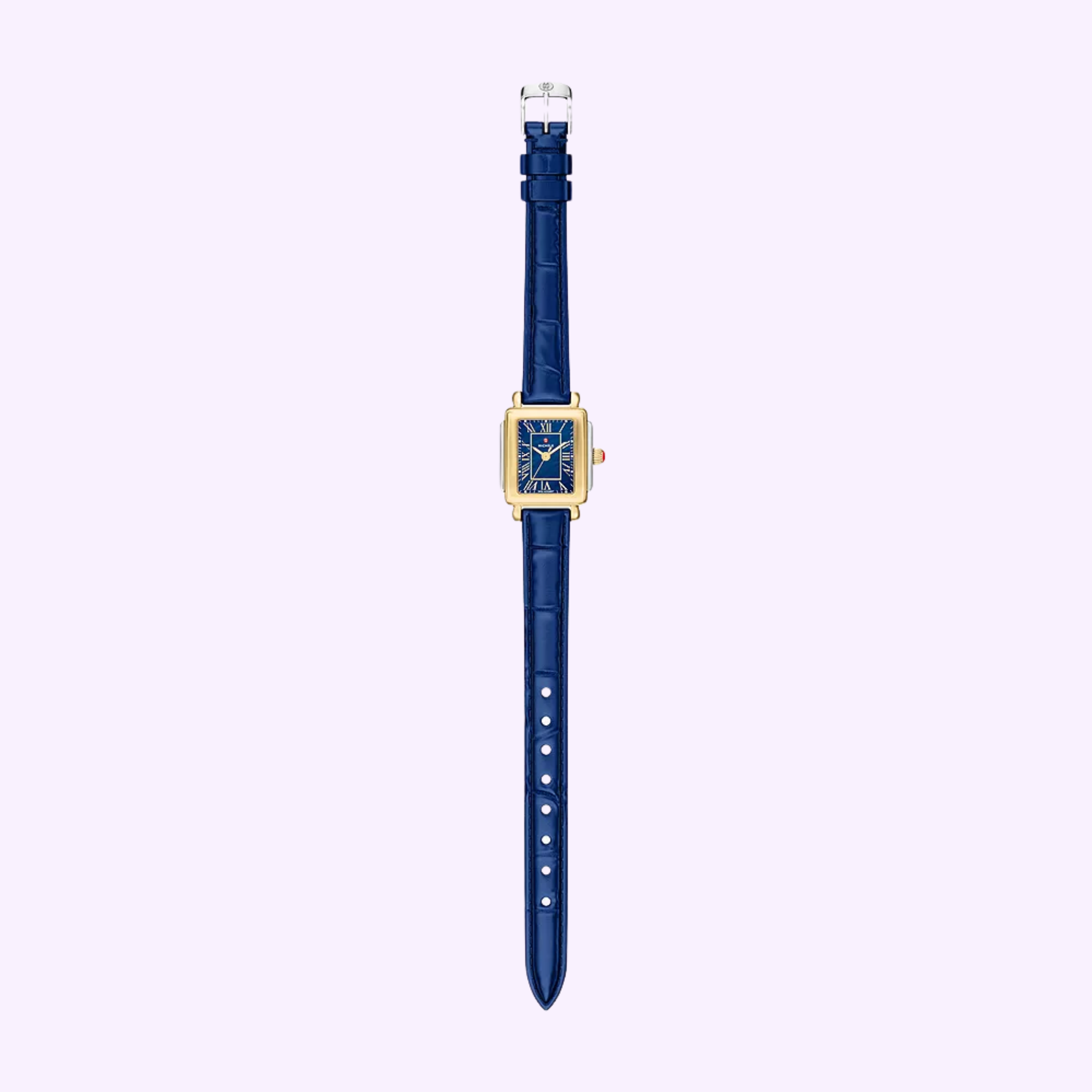 The Michele Watches Deco Madison Mini MWW06D000180, a gold rectangular timepiece with a blue face adorned with Roman numerals and set on a navy leather strap, is elegantly displayed against a light purple background.