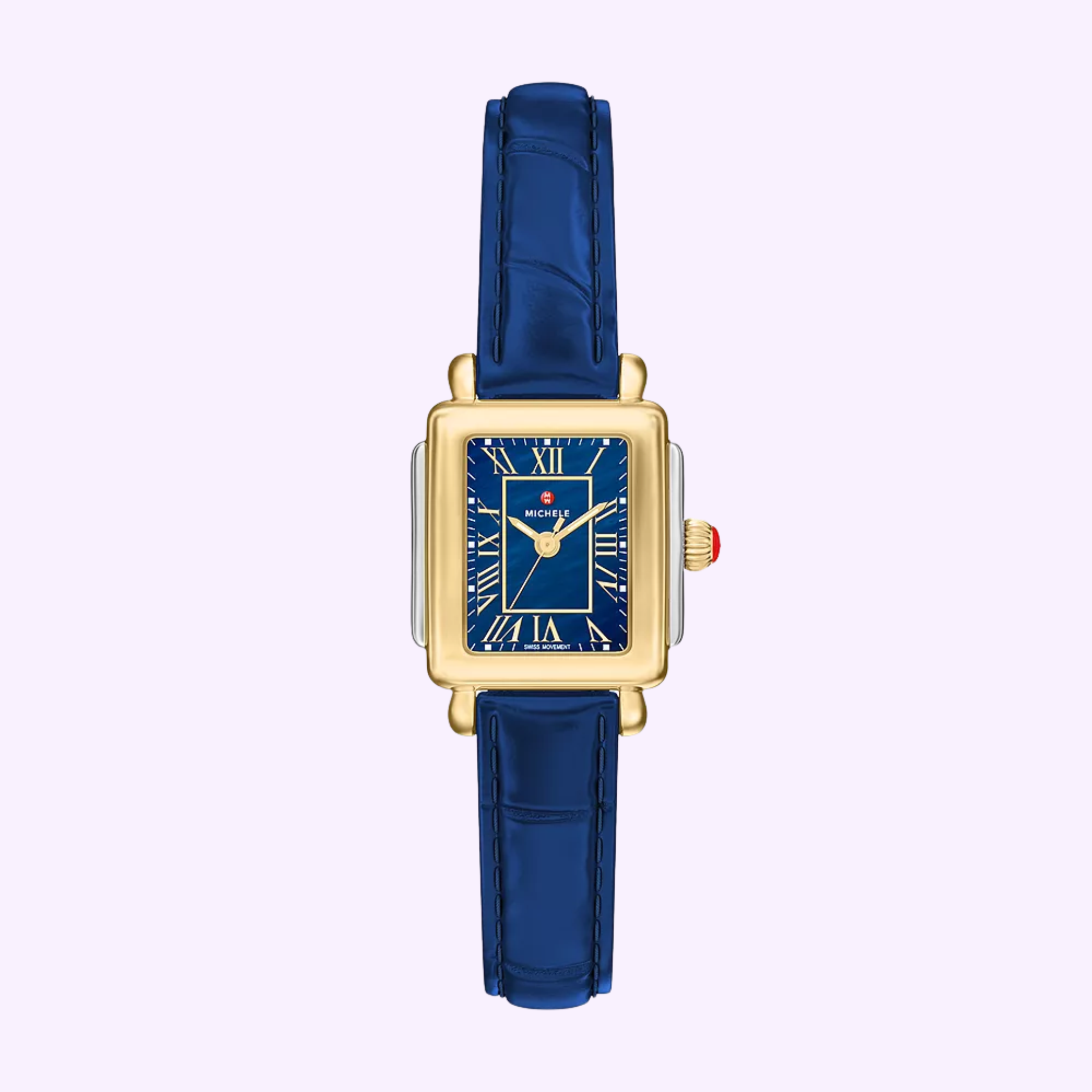 A Michele Watches Deco Madison Mini MWW06D000180 wristwatch featuring a rectangular gold case, a blue Roman numeral dial, and a navy leather strap, displayed on a light purple background.