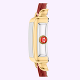 Side view of the Michele Watches Deco Madison Mini MWW06D000181 wristwatch by Michele Watches, featuring a gold and silver case, ruby red leather strap, and a crown adorned with a red circle containing white MW letters within a gear-like gold frame. Set against a pale purple background.
