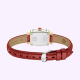 A Michele Watches Deco Madison Mini MWW06D000181 wristwatch featuring a striking ruby red leather strap, an elegant gold and silver case, and a crown with a red tip. The back of the watch displays the Michele Watches brand name along with intricate details.