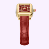Michele Watches Deco Madison Mini MWW06D000181 features a square gold case with a striking ruby red dial adorned with gold Roman numerals and hands, complemented by a glossy ruby red leather strap in the brand’s signature Deco Madison Mini style, presented against a light purple background.