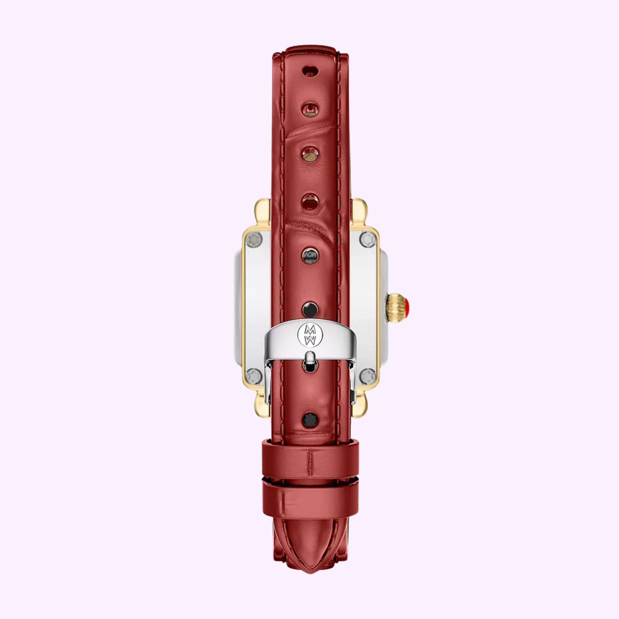 The Michele Watches Deco Madison Mini MWW06D000181 features a ruby red leather strap, a gold and silver case, and is displayed from the back to reveal its silver buckle and decorative crown, set against a light purple background—an elegant timepiece that perfectly captures the signature style of Michele Watches.