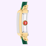 Side view of a rectangular gold Michele Watches Deco Madison Mini MWW06D000182 wristwatch by Michele Watches, featuring a green leather strap and a red crown with the letter W in white, set against a light purple background.