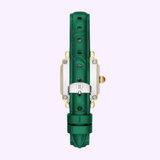 The Michele Watches Deco Madison Mini MWW06D000182 by Michele Watches is showcased with a striking green leather strap and a silver buckle arranged vertically. Its gold case features a white side and a crown on the right, all set against a light lavender background.