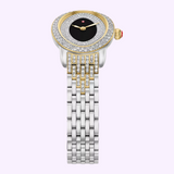 The Michele Watches Serein Oval Diamond MWW21H000005 by Michele Watches showcases an elegant oval, diamond-studded bezel, a sleek black dial with gold accents, and a two-tone silver and 18K gold-plated metal bracelet featuring precise Swiss movement, artfully displayed against a light purple background.