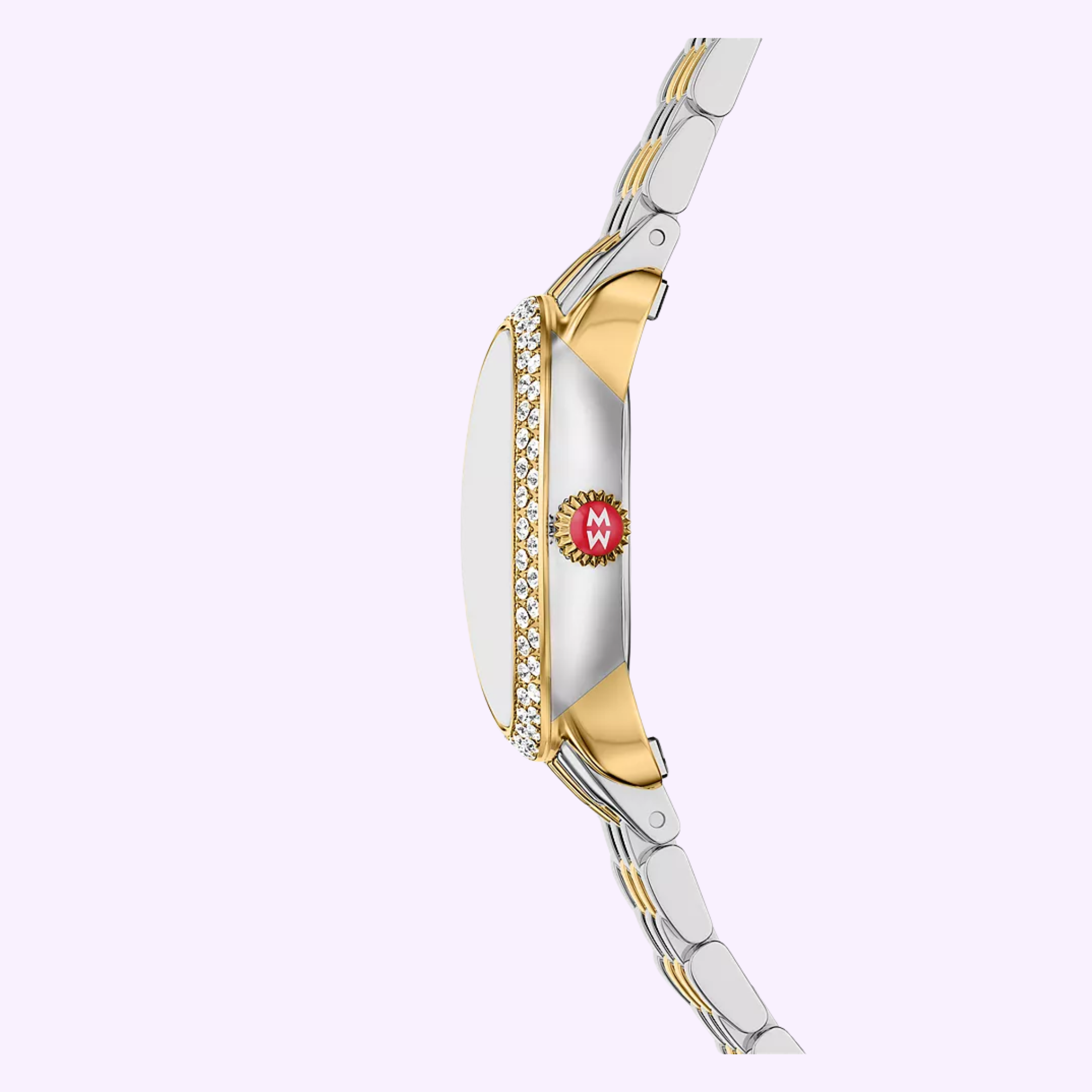 Side view of the Michele Watches Serein Oval Diamond Two-Tone 18K Gold-Plated Watch (MWW21H000002) with a diamond bezel, two-tone band, and red “M” crown by Michele Watches, set on a pastel background.