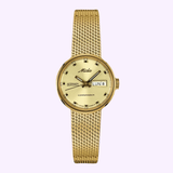 The Mido M716937213 Commander Mesh Strap by Mido Watches is a gold women’s watch with a mesh band, round gold dial, black hour markers, and a right-side day-date window displaying LUN 8.