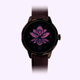 The Mido Watches Rainflower Night M0432073610600 is a Swiss women's watch with an automatic movement, dark case, brown leather strap, and a stylized purple and pink lotus flower on its dark face.