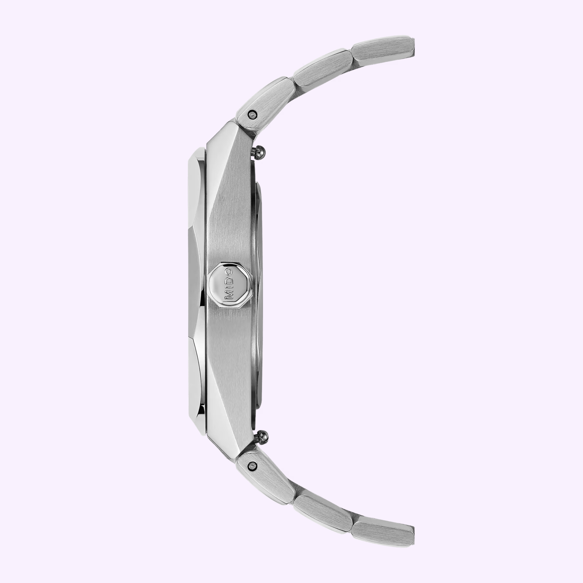 Side profile of the Mido Watches Multifort 8 One Crown M0555071105100 in stainless steel with a brushed bracelet and octagonal crown against a light lavender background. This Swiss automatic watch runs on the robust Caliber 80 movement.