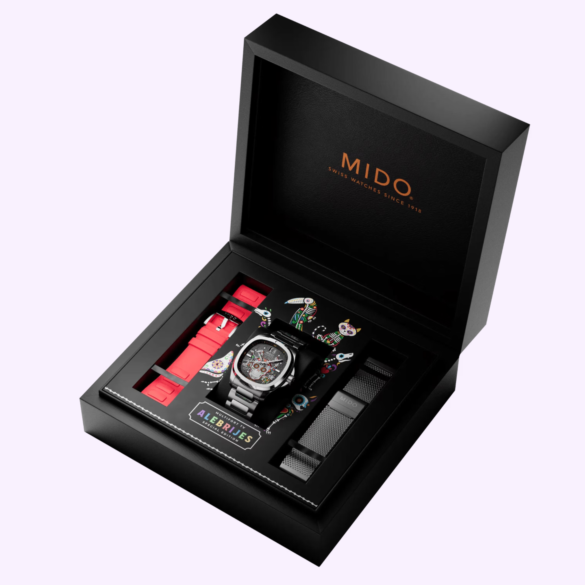 The Mido Watches Multifort TV Big Date Alebrijes M0495261108102 gift box includes a watch, two extra straps, and a vibrant Alebrijes-inspired Día de los Muertos illustration on the inner lid.