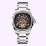 The Mido Watches Multifort TV Big Date Alebrijes M0495261108102 features a silver case, black dial with a vibrant sugar skull motif, floral accents, visible gears, and a stylish metal bracelet.