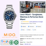 A stainless steel Mido Watches Multifort TV Big Date Chronometer M0495671104100 with a blue grid-patterned dial, shown next to store information for an eyewear and watch boutique in Miami.