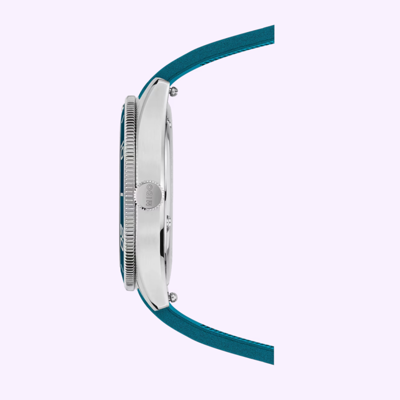 Side view of the Mido Ocean Star 39 showing stainless steel case, textured bezel, and DW-engraved crown