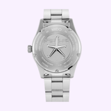 The back view of the Mido Watches Ocean Star 39 M0269071104101 shows its silver stainless steel band and case, engraved with a starfish design and various details about the watch's features and materials.