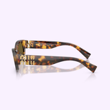 The Miu Miu Sunglasses 0MU B04S 14L09Z53 feature a bold tortoiseshell frame with thick arms and a striking mirrored MIU logo on the side. Presented against a light pink background, these Miu Miu sunglasses are photographed in profile to highlight their distinctive design and reflective branding—an embodiment of genuine designer eyewear style.