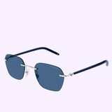 The Montblanc MB0270S-003 51 Sunglass MAN METAL features a rimless square design with blue lenses, complemented by a slender silver bridge and adjustable nose pads. The thin, dark blue arms complete the look of these stylish Montblanc sunglasses, shown against a plain light background.