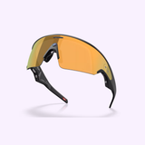 Sleek black Oakley Meta Vanguard Sunglasses 0OW8001 80010452 featuring a single curved amber lens and integrated ear stems from Oakley Meta Sunglasses are showcased on a light background with a subtle shadow beneath.