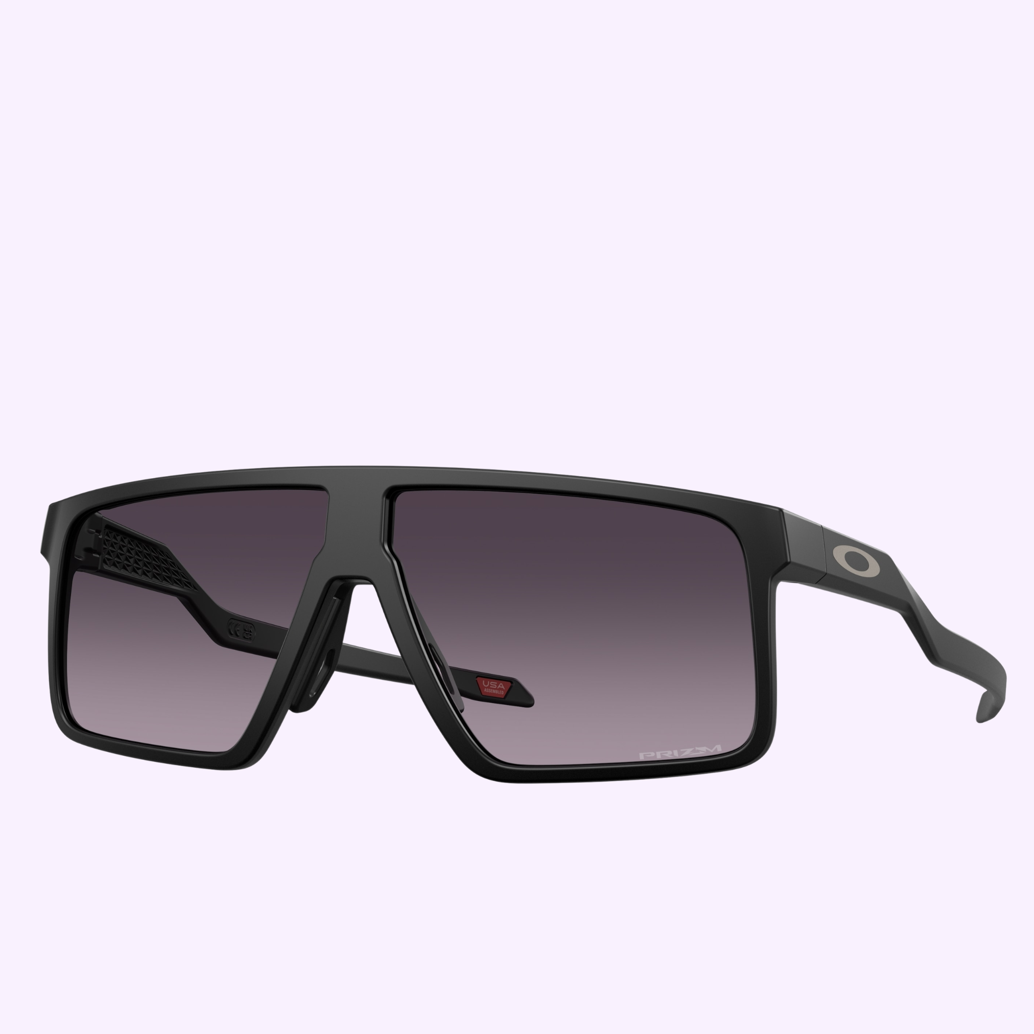 The Oakley Sunglasses 0OO9285 92850661 feature a black rectangular frame with dark gradient lenses, a bold nose bridge, and Oakley logo on the arms, reflecting sleek innovation against a light purple background.