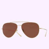 The Oliver People OV1278ST 5292C5 58 Ellerston Men Sunglasses by Oliver People feature a gold-tone titanium aviator frame with brown-tinted lenses, reminiscent of classic Oliver People designs, shown against a light purple background.