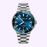 Oris Watches Aquis Date stainless steel divers watch with a blue dial, blue ceramic bezel, and a date window at the six o’clock position.