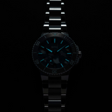 An Oris Watches Aquis Date Upcycle Calibre 400 stainless steel dive watch featuring a dark, marbled recycled PET dial with glowing light-blue hands and hour markers against a black background.