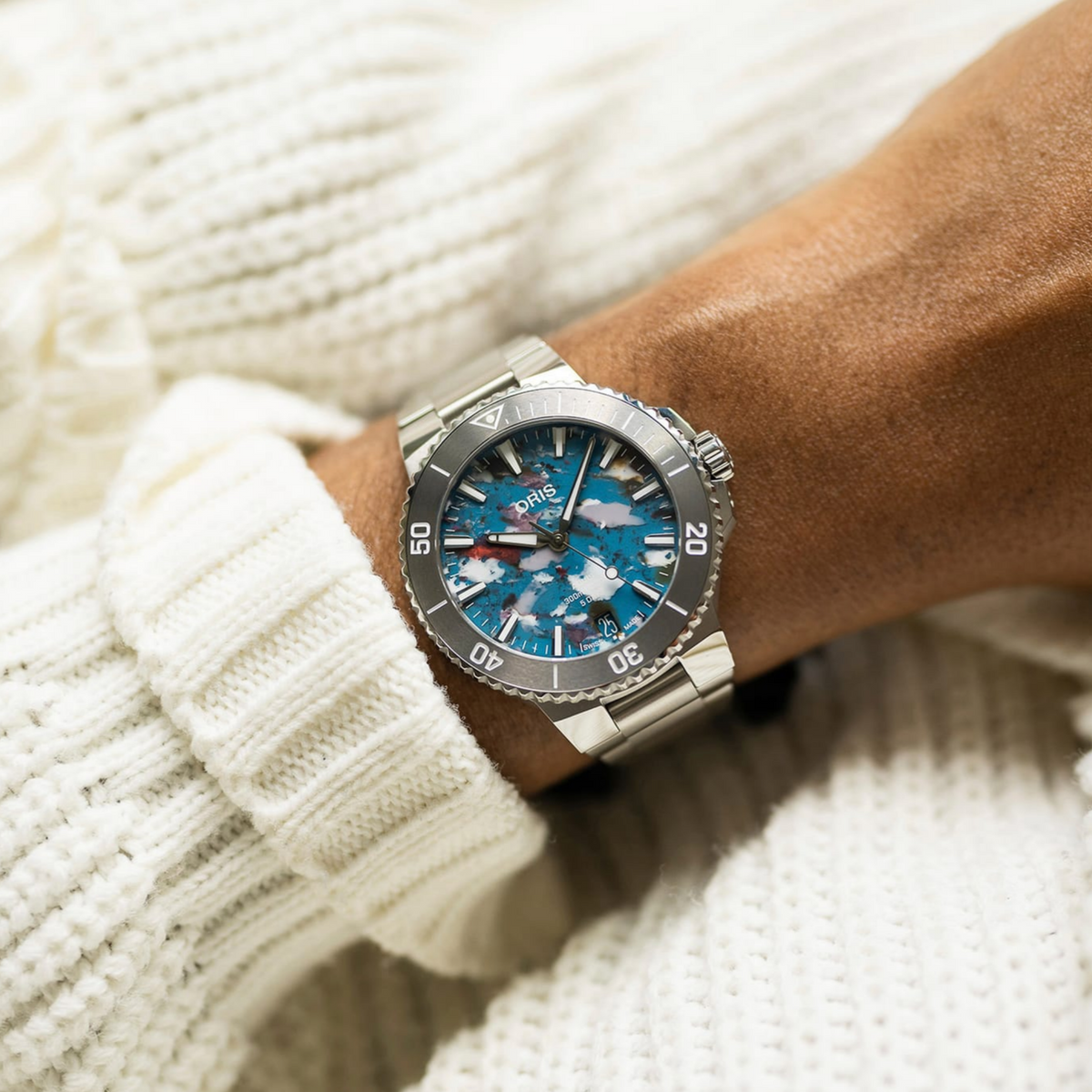 Oris Aquis Date Upcycle stainless steel bracelet and case with multicoloured recycled PET dial