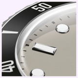 Close-up view of an Oris Watches Divers Date watch face with a grey dial, metallic hour markers, and a black rotating bezel with white numerals.