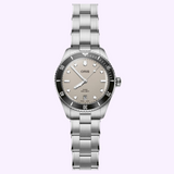 An Oris Watches Divers Date stainless steel dive watch featuring a beige dial, black rotating bezel, and a metal link bracelet.