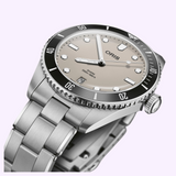 Oris Watches Divers Date watch with a light gray dial, luminous indices, a black rotating bezel, and a stainless steel link bracelet.