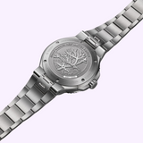 Stainless steel case back of an Oris Watches Great Barrier Reef Limited Edition IV, engraved with coral and starfish, featuring the text Great Barrier Reef Limited Edition and an individual serial number.