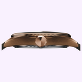Side profile of an Oris Watches ProPilot Bronze case featuring a fluted bezel and a central winding crown.