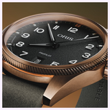 Oris Watches ProPilot Bronze watch featuring a textured black dial, white numerals, and a date window at the six o’clock position.
