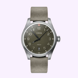 Oris Watches ProPilot Date analog wristwatch featuring a dark olive dial, Arabic numerals, a date window at the six o’clock position, and a gray suede strap.