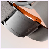Close-up of an Oris Watches ProPilot Date watch clasp with the word LIFT engraved on the metal surface.