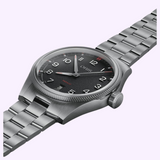 Oris Watches ProPilot Date analog watch with a black textured dial, white numerals, and a silver metal link bracelet.