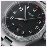 Oris Watches ProPilot Date watch featuring a black textured dial, white Arabic numerals, luminous hands, and a date window at the six o’clock position.