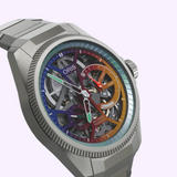 Oris Watches ProPilot X Gonzo Edition skeleton watch with a multi-colored, segmented dial featuring a rainbow-inspired chapter ring, white hands with green accents, and a metallic link bracelet.