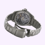 Titanium Oris Watches ProPilot X Gonzo Edition wristwatch with an open case back revealing the mechanical movement and a deployant clasp engraved with the word LIFT.