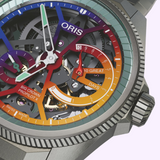 A skeletonized Oris Watches ProPilot X Gonzo Edition mechanical watch with a multi-colored, gradient dial featuring a ten-day power reserve indicator and a textured metallic bezel.