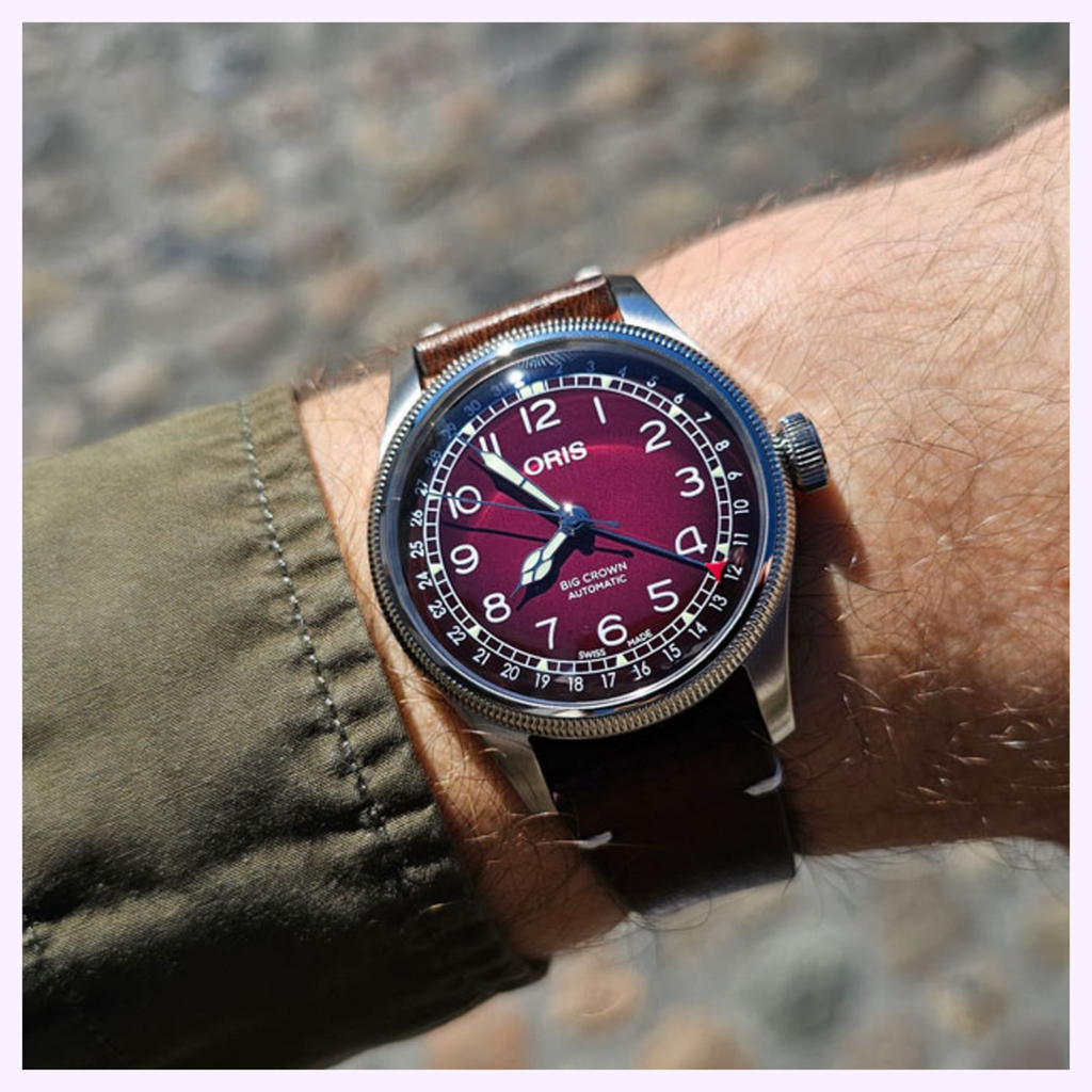 Oris Big Crown Pointer Date x Cervo Volante worn on a wrist, deep red dial with white numerals