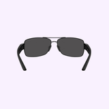 PRADA Sunglasses 0PS B52S 1AB06F65 shown front-facing on a light purple background, featuring black rectangular frames, dark lenses, and partially folded arms. Brand: Prada Sunglasses.