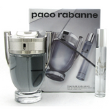 The Paco Rabanne Invictus 2PC Travel Set For Men by Paco Rabanne Perfumes includes a trophy-shaped fragrance bottle, a travel spray, and comes in a box featuring the brand name and bottle image.
