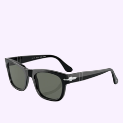 The Persol 0PO3269S 95/58 Sunglasses by Persol Sunglasses feature a black rectangular frame with dark lenses, silver accents on the temples, and a subtle keyhole bridge—embodying the sophisticated Miami-inspired style and timeless Persol elegance, beautifully displayed against a light purple background.