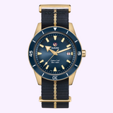 Rado Watches Captain Cook Bronze Limited Edition R32504208 automatic diving watch featuring a blue dial, luminous indices, and a black fabric strap with a central gold stripe.