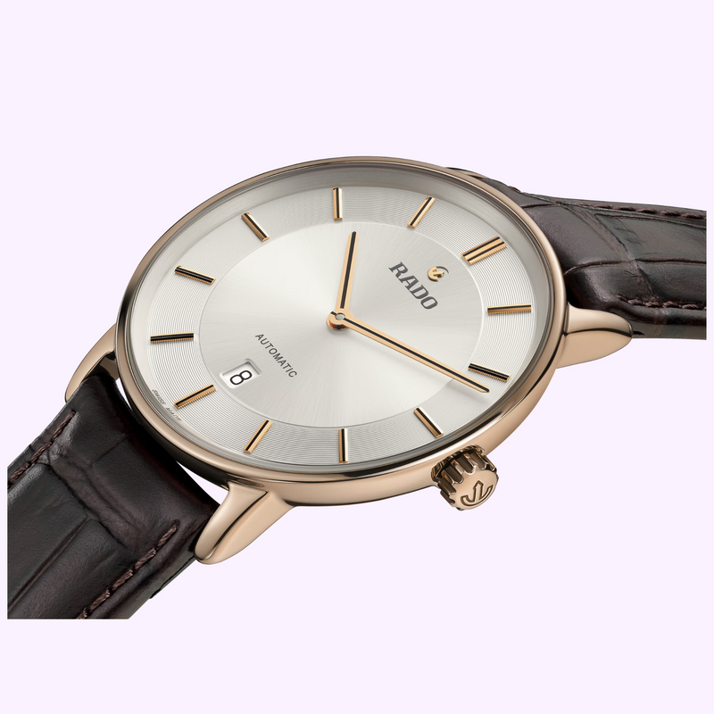 Close-up of the Rado DiaMaster R14068036 silver dial with rose-gold-colored indexes, hands and date window at 6 o'clock