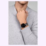 A person in a light gray sweater showcases a Rado Watches Florence Diamonds R48912733 on their left wrist, raising their hand near their chin.