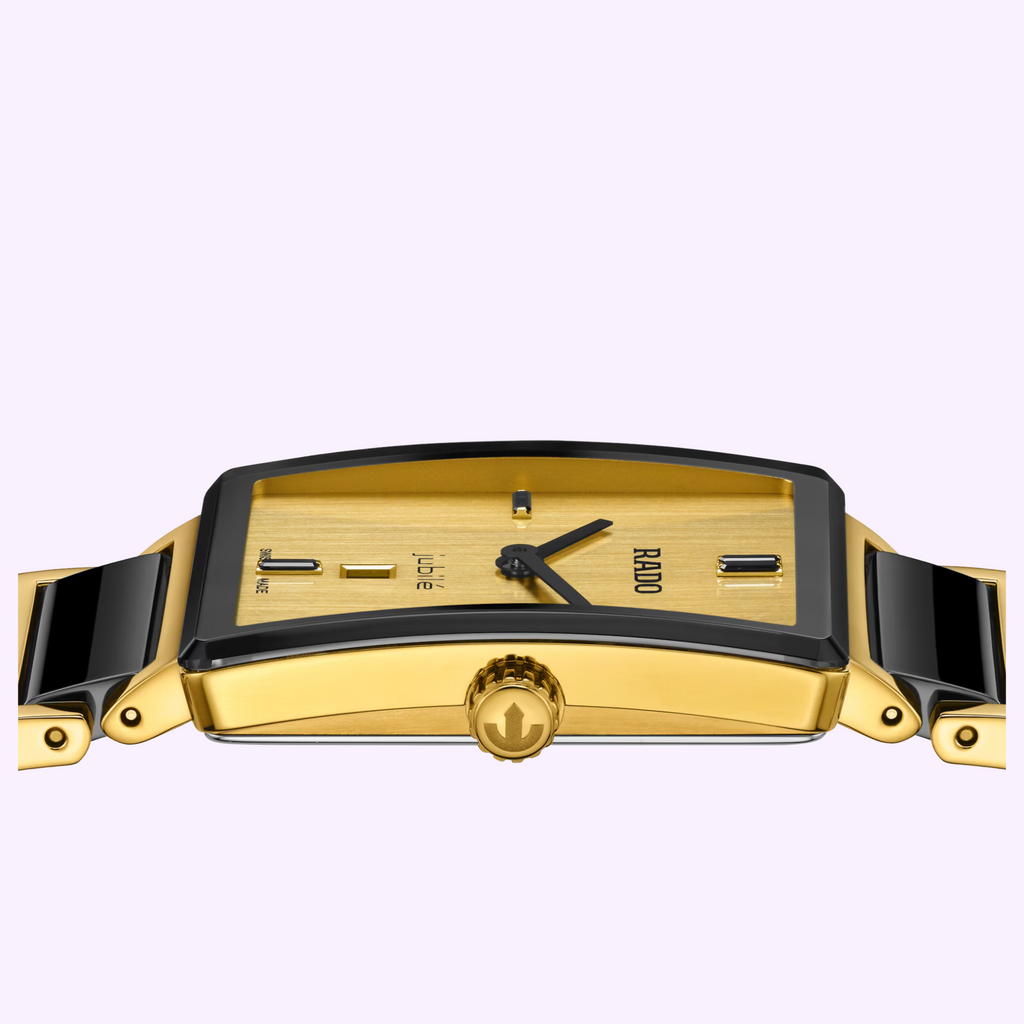 Side profile of the Rado Integral Limited Edition R20254702 showing the slim gold-tone case and black ceramic links